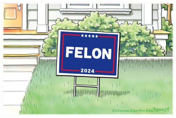 Election lawn sign in familiar Trump colors. Sign reads, “FELON 2024”