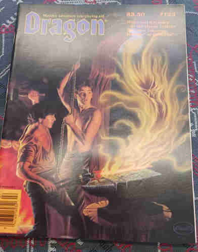 Dragon magazine cover featuring two young blacksmiths and a fire elemental.
