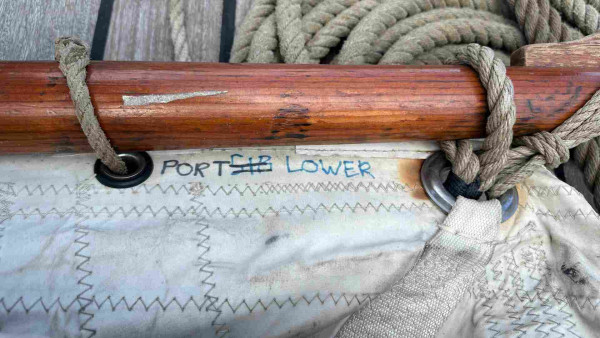 Sail gaff with label “port starboard lower” and the starboard is crossed out. 