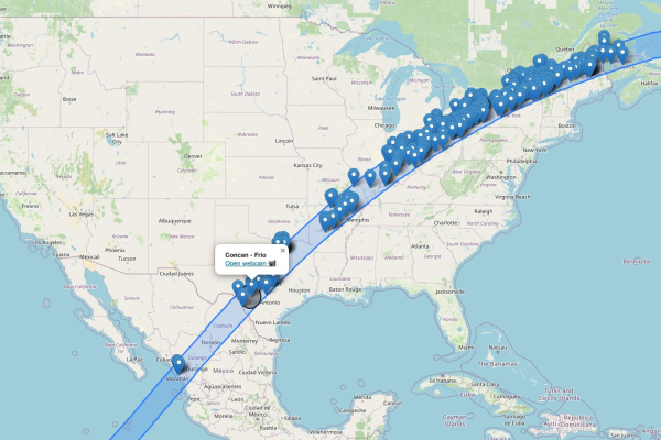 A map of the US, showing the path of the 2024 eclipse, dots for each webcam, and a black circle showing the eclipse umbra.