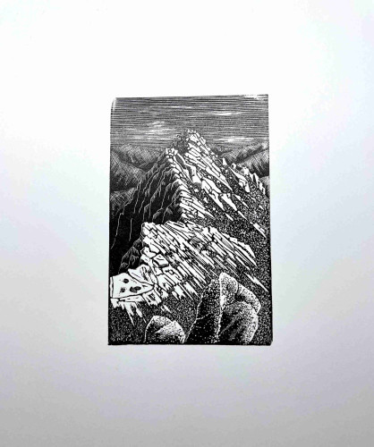 First test print of wood engraving in black ink. Looking along a rocky mountain arête lit strongly from the right.
