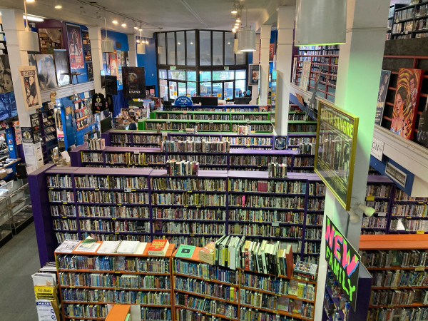 A massive room with thousands upon thousands of DVDs and Blu Rays on shelves.