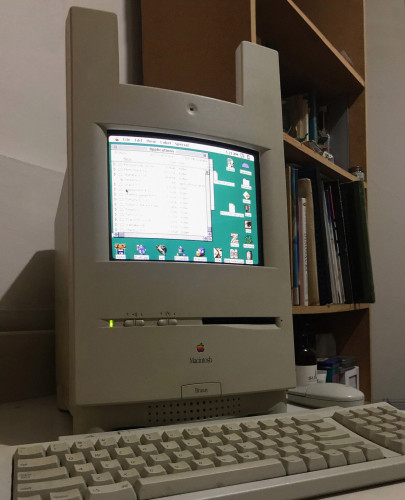 A photo of a Macintosh Colour Classic but with bunny ears. They look vaguely like antennas, but no they're actually bunny ears. The badge on the front reads "Bnuuy"