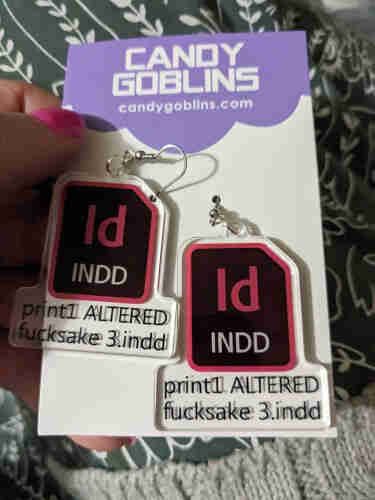 Earrings. They are an indesign icon, with a filename beneath that reads "print1 ALTERED fucksake 3.indd."