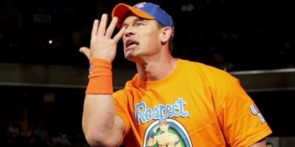 John Cena does the "can't see me" hand gesture