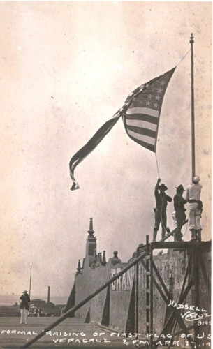 John H. Quick raises the American flag over Veracruz. Caption reads "Formal raising of first flag of U.S. / Veracruz 2 P.M. April 27, 1914"  By Photograph by Hadsell taken during the U.S. occupation of Veracruz, 1914. - Taken on 27 April 1914, Public Domain, https://commons.wikimedia.org/w/index.php?curid=846574