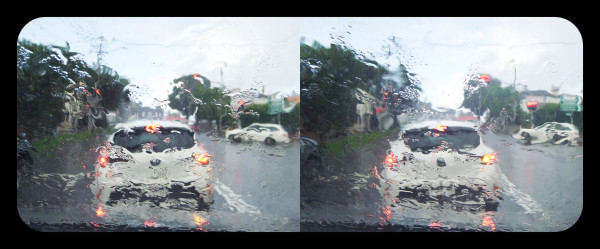 Parallel view stereo image of a car through a rain soaked windscreen. 