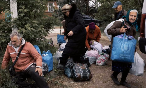 Residents of Vovchansk and nearby villages arrive at the evacuation point, an undisclosed location in the Kharkiv region. Photograph: Jędrzej Nowicki/The Guardian
