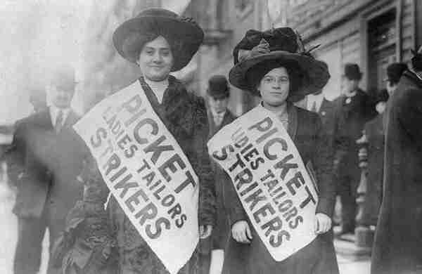 Two women strikers on picket line during the "Uprising of the 20,000", garment workers strike, New York City. Both are wearing hats, overcoats, and sashes that read: “Picket Ladies Tailors Strikers.” By Bain News Service - This image is available from the United States Library of Congress&#039;s Prints and Photographs divisionunder the digital ID cph.3a49619.This tag does not indicate the copyright status of the attached work. A normal copyright tag is still required. See Commons:Licensing., Public Domain, https://commons.wikimedia.org/w/index.php?curid=3752739