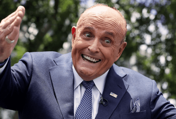 Picture of Rudy Giuliani with a maniacal grin.