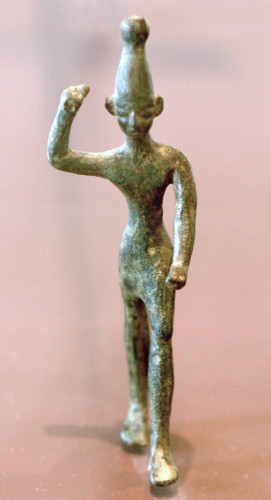 "Figure of Ba'al with raised arm, 14th–12th century BC, found at ancient Ugarit (Ras Shamra site), a city at the far north of the Phoenician coast. Louvre, Paris"