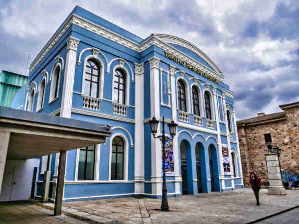 Spanish style facade with classic windows. In blue and white 