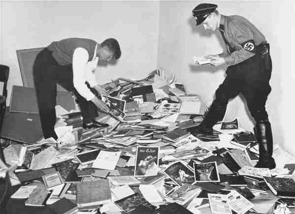 German students and Nazi SA members plunder the library of Magnus Hirschfeld, director of the institute. By Unknown author - United States Holocaust Memorial Museum, Photograph #01628 https://collections.ushmm.org/search/catalog/pa26351, Public Domain, https://commons.wikimedia.org/w/index.php?curid=10541598