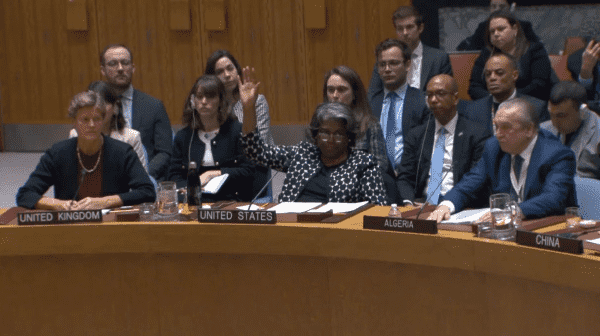 US representative raising hand to veto UN Security Council resolution calling for an immediate ceasefire in Gaza