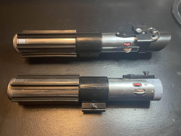 2 awesome lightsaber replicas.  I think one is Luke's that he inherited from Vader, not sure.
