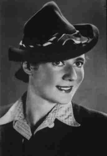 A young woman in a stylish hat.