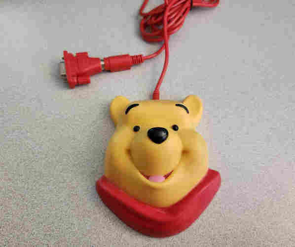 A Winnie-the-Pooh serial mouse, it's shaped like his head.