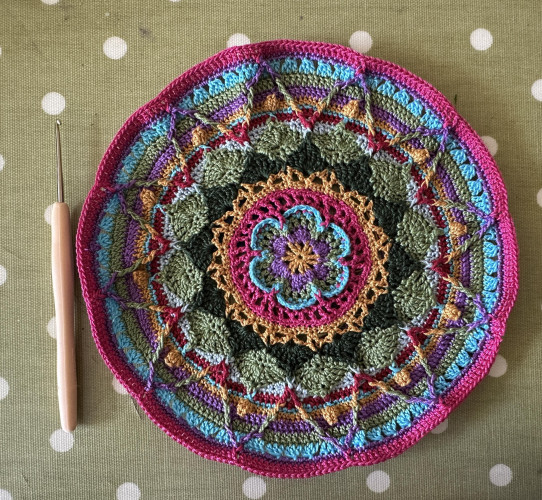 A multicoloured crocheted mandala 
