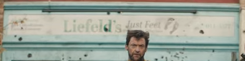 Screen grab from Deadpool & Wolverine with the words "Liefeld's Just Fee" on a store front