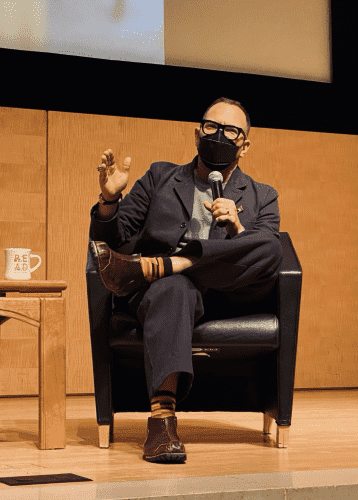 Author Cory Doctorow at SF PL , in suit, mask, and those shoes
