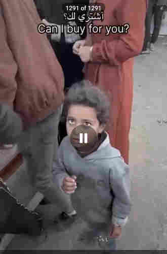 screen capture of video of a hungry child looking for sweets in Gaza