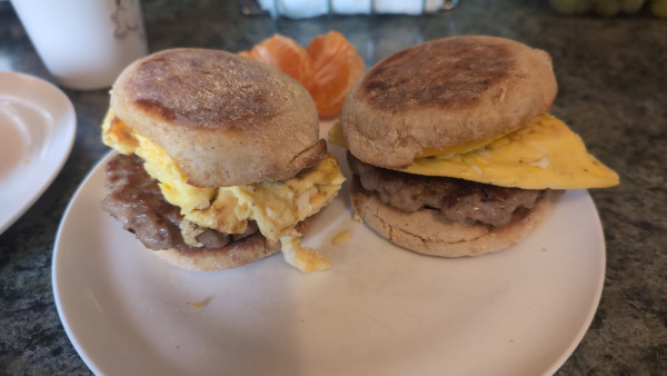 Two sausage muffins with eggs.