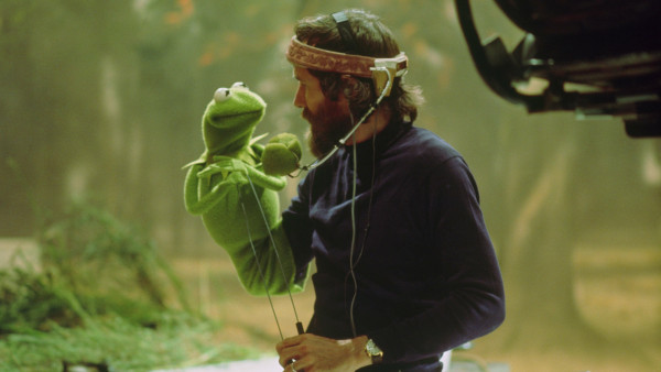 Photo of Jim Henson puppeteering Kermit the Frog