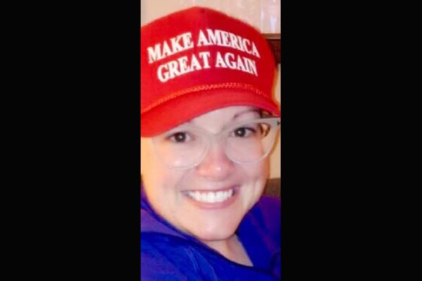 Jenni Byrne wearing a red Make America Great Again hat