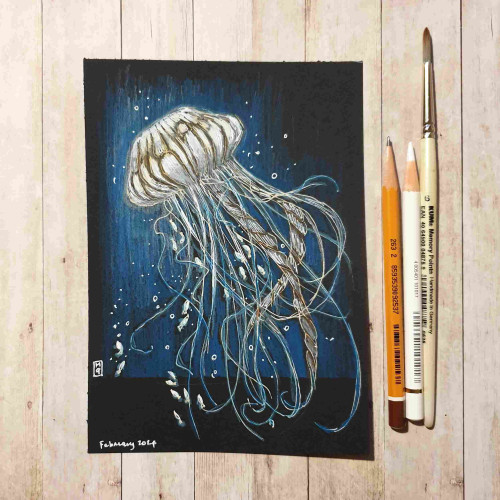 A drawing of a jellyfish on black paper.