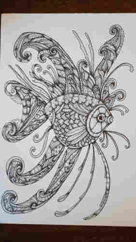 A fish with lots of ornate fins drawn in black ink line art and filled with doodle details 