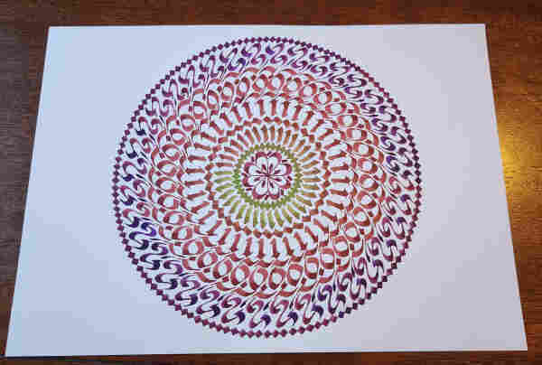 A circular mandala of repeating patterns made from calligraphy strokes, in green, red, and purple