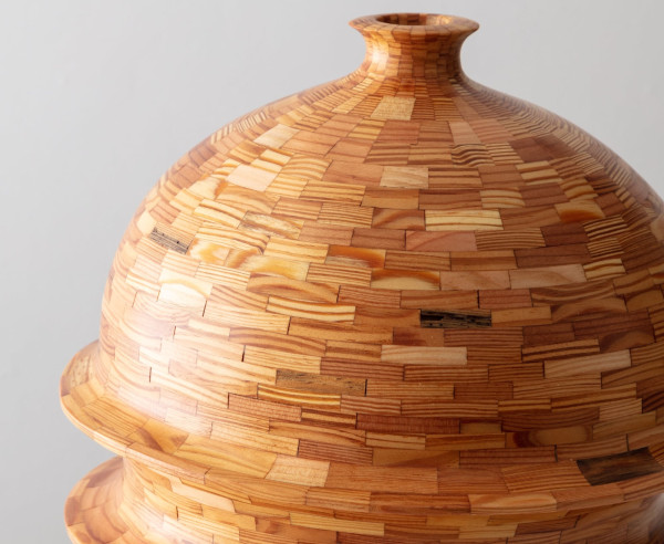a detail of a wooden vessel made of light wood components fitted together