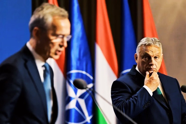 Hungarian Prime Minister Viktor Orban, right, listens as NATO Secretary-General Jens Stoltenberg speaks during a news conference in Budapest, Hungary, on June 12, 2024 [Marton Monus/Reuters]