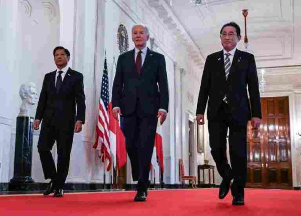 US President Joe Biden held a trilateral meeting with Japanese Prime Minister Fumio Kishida and Philippine President Ferdinand Marcos Jr / © AFP