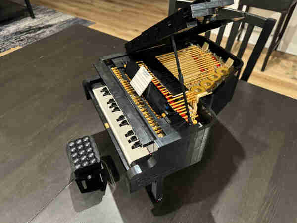 A small grand piano made of lego
