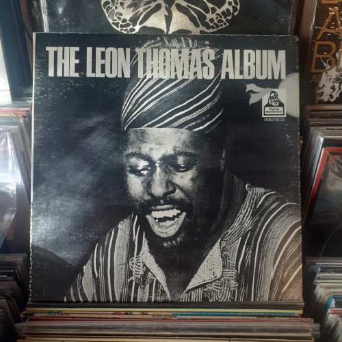 Album cover features a black and white photo of Leon Thomas. He's wearing a dashiki and a headscarf, and appears to be singing.