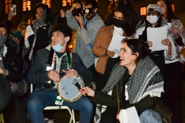 Student protesters playing music at the Columbia University encampment in New York City [Yasmeen Altaji/Al Jazeera]