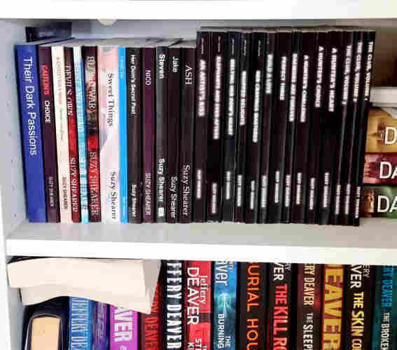 A line up of books on a bookshelf - all by the same author. Suzy Shearer (me...lol).
29 books all together.