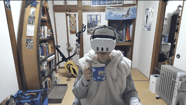 Screen shot form my computer, showing that I'm sitting at my desk wearing a VR headset and holding a mug of tea!