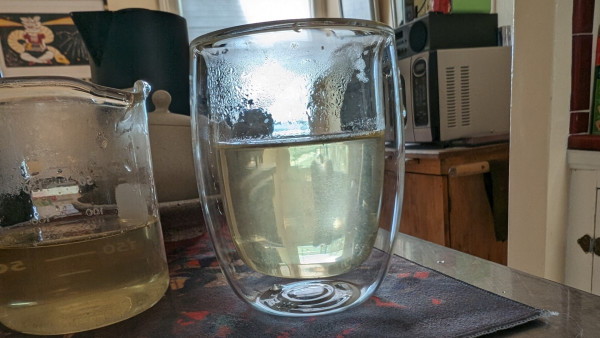 Green tea in a clear glass bowl.