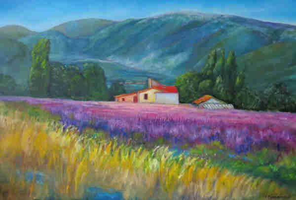Colourful painting of a landscape in the Provence in France. In the foreground is high light brown grass with some touches of blue in it. Behind this is a field with grass that is coloured in various shades of pink and purple. At the end of this field is a soft orange, soft yellow and white coloured house with a red roof. Left and right of the house are many green trees. On the horizon are high mainly blue coloured mountains, with some green on them here and there. The sky is bright blue. 