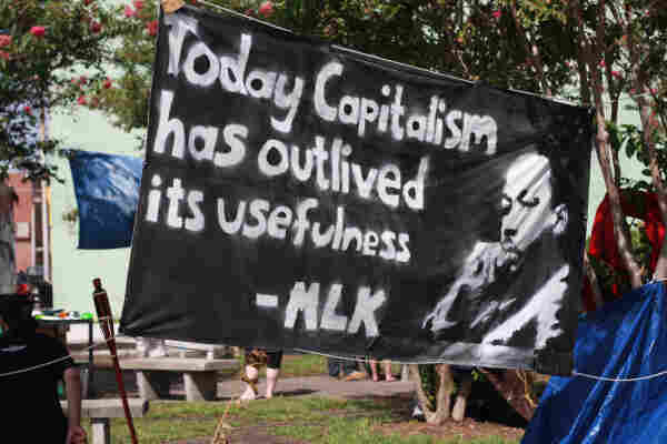 Banner at the 2012 Republican National Convention with an image of Martin Luther King Jr. and his quote: “Today capitalism has outlived its usefulness.” By Liz Mc - Flickr: &#039;Today capitalism has outlived its usefulness&#039; MLK, CC BY 2.0, https://commons.wikimedia.org/w/index.php?curid=20987101