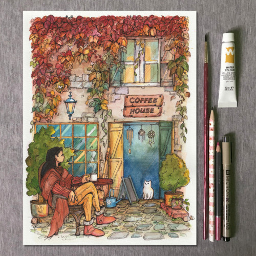 Aquarelle painting on paper with artistic tools aside depicting a coffee house, a lady, and a cat in a cozy autumn vibe. Made by zizudraws