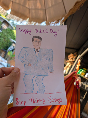 A handmade card, held up in my hand as I recline in the backyard hammock.

It features a hand-drawn illustration of David Byrne in his Big Suit.

It reads:

Happy Father's Day!

Stop Making Sense
