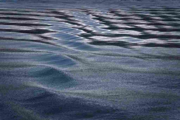 Shallow waves created by a boat through calm waters 