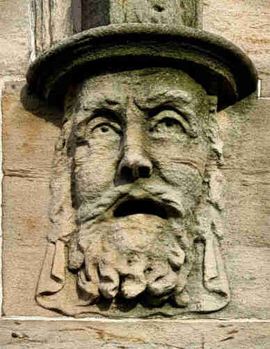 A sculpted face on a Georgian church building.