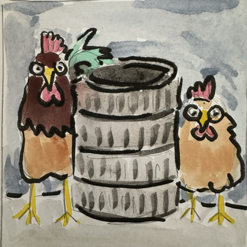Rooster and hen standing on either side of a stack of tires. 