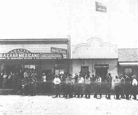 Magonista guerrillas in front of a store with the banner,
"Tierra y Libertad" in Tijuana, 1911. By? (San Diego Historical Society's Title Insurance and Trust Collection). - http://www.sandiegohistory.org/journal/80fall/revolutionimages.htm, Public Domain, https://commons.wikimedia.org/w/index.php?curid=1788021
