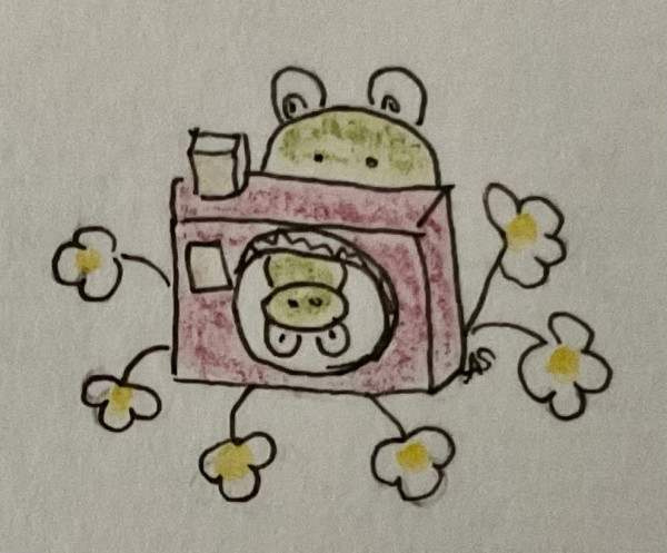 A froglike creature in front of a camera that is bedded in daisies, about to take a photo of another froglike creature.

AutoALT: Hand-drawn cartoon character resembling a monster inside a washing machine surrounded by flowers.