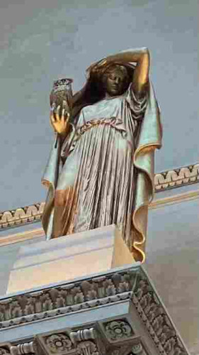 Statue of Athena, I guess with an owl in her hand and a hood over her head like she’s hiding